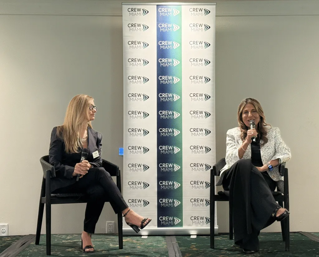 Moderator Wendy Ruiz Cofiño interviews Ramola Motwani on stage at the CREW Miami fireside chat at Mayfair House Hotel & Garden.