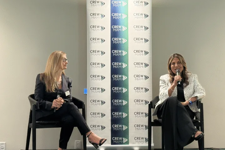 Moderator Wendy Ruiz Cofiño interviews Ramola Motwani on stage at the CREW Miami fireside chat at Mayfair House Hotel & Garden.